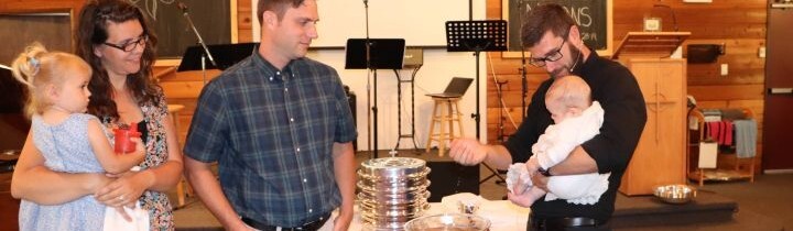Infant being baptised